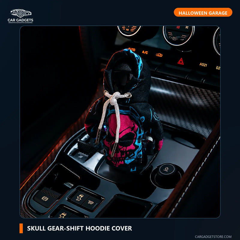 Neon cyan and magenta skull hoodie cover installed over a compatible car gear selector