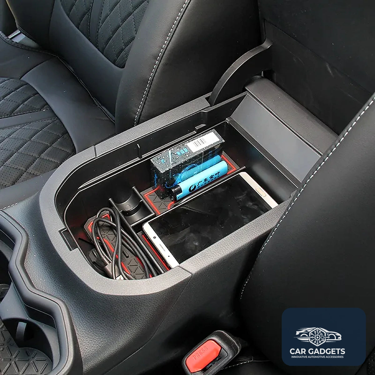 Armrest organizer installed with small items in a Toyota RAV4 center console