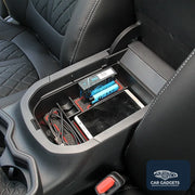 Armrest organizer installed with small items in a Toyota RAV4 center console