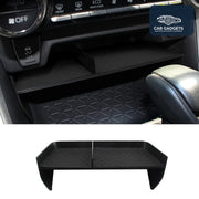 Black front console storage shelf installed below Toyota RAV4 climate controls