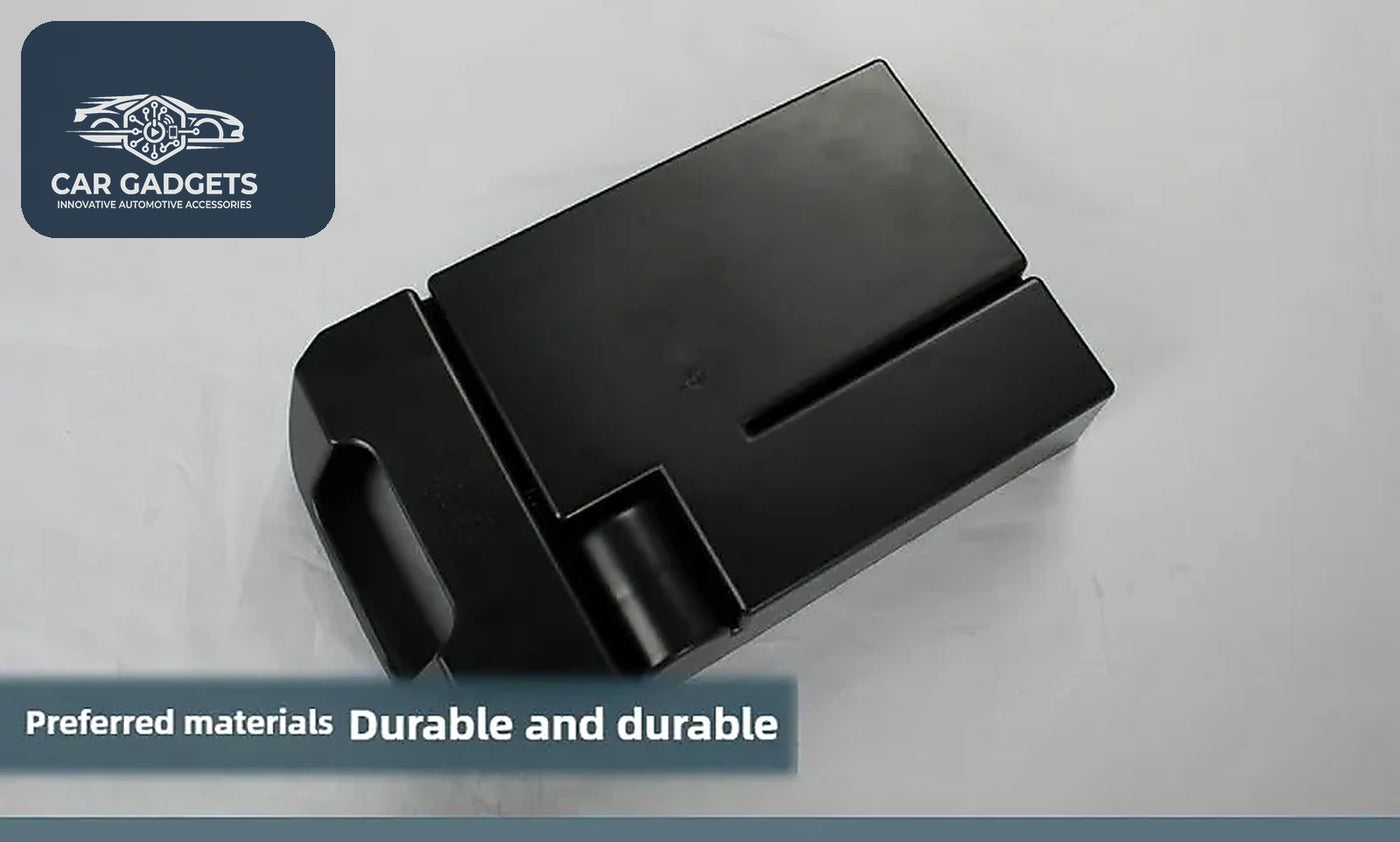 Black molded ABS armrest organizer photographed from the underside