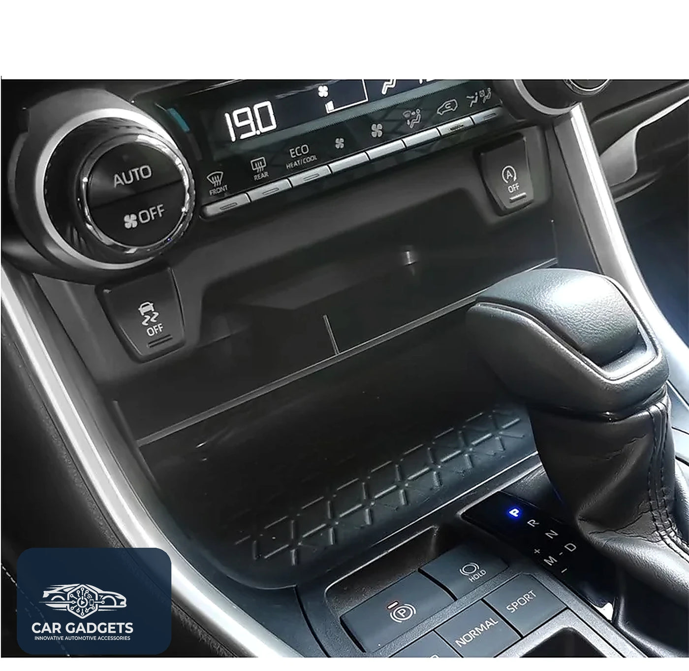 Front console dividing shelf installed below the climate controls in a Toyota RAV4