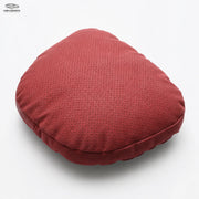 Red perforated car neck pillow on a white background
