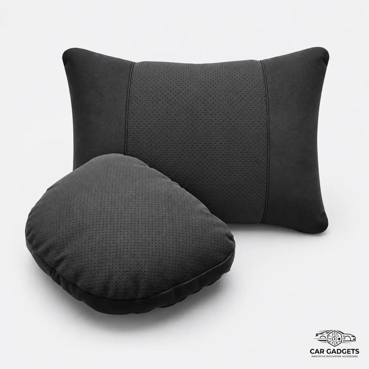 Black car seat neck and lumbar pillow set on a white studio background