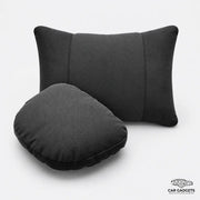 Black car seat neck and lumbar pillow set on a white studio background