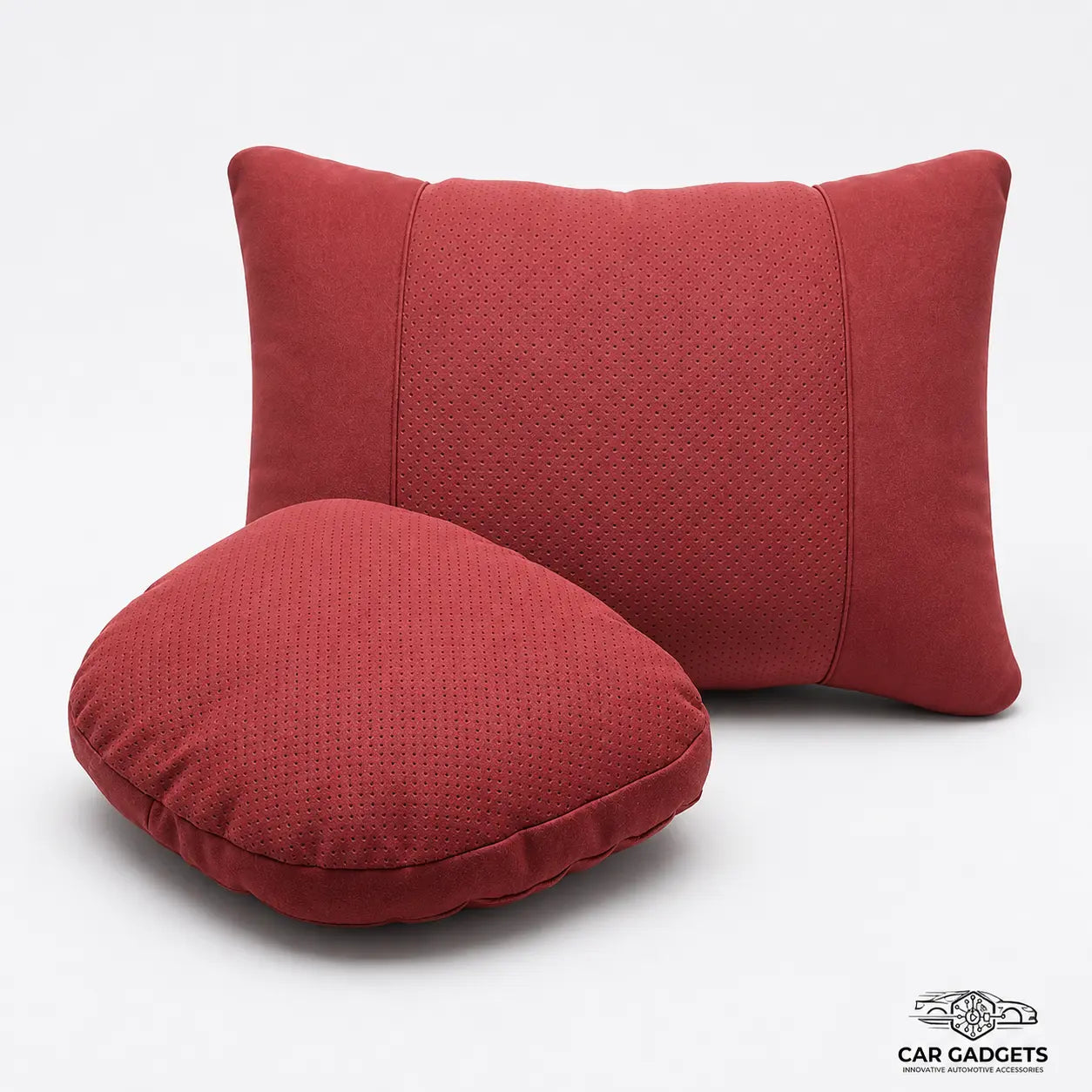 Red car seat neck and lumbar pillow set on a white studio background