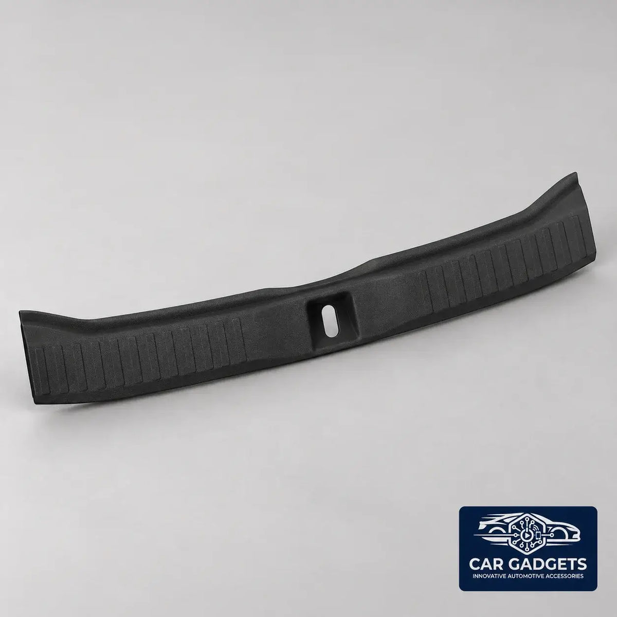 Side profile of the curved black inner trunk sill guard
