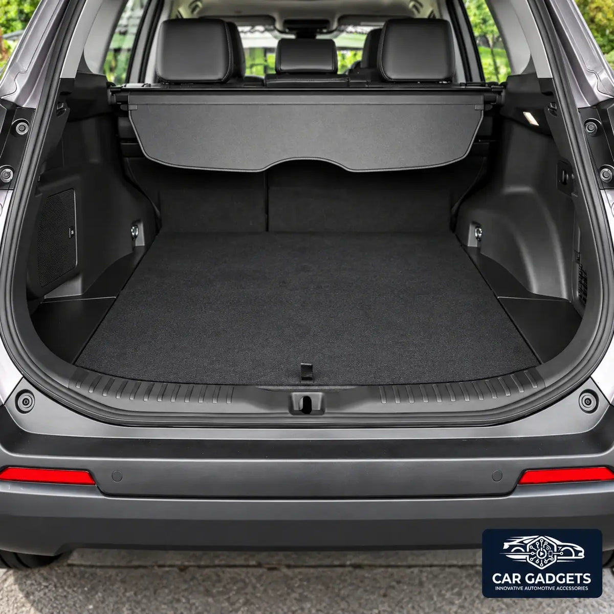 Black inner cargo threshold guard shown at the rear opening of a red vehicle; six-piece set only
