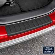 Close view of the black rear exterior bumper loading-edge protector